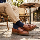 Herren-Slipper aus hellbraunem Leder mit dicker Sohle und Quasten